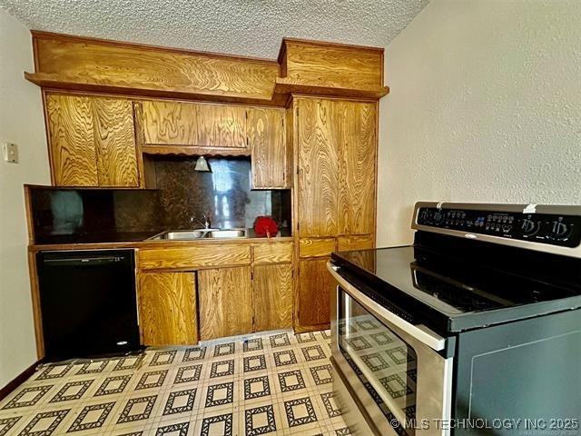 1305 7th Ave NW, Ardmore, OK 73401 - kitchen featuring stainless steel electric range, black dishwasher, a textured ceiling, brown cabinetry, and tasteful backsplash