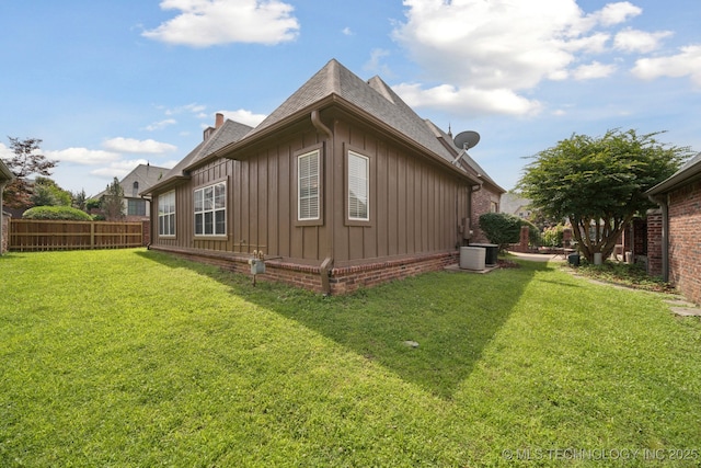 7721 E 101st Pl, Tulsa, OK 74133 - view of home's exterior with board and batten siding and a shingled roof
