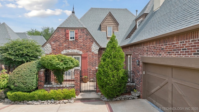 7721 E 101st Pl, Tulsa, OK 74133 - view of front of house with brick siding and a gate