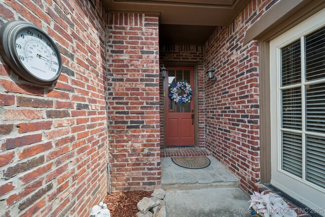 7721 E 101st Pl, Tulsa, OK 74133 - doorway to property with brick siding