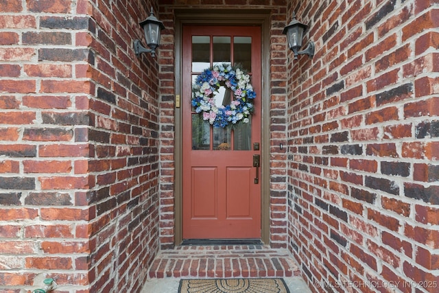 7721 E 101st Pl, Tulsa, OK 74133 - doorway to property with brick siding