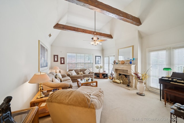 7721 E 101st Pl, Tulsa, OK 74133 - carpeted living area featuring beamed ceiling, high vaulted ceiling, a lit fireplace, and a ceiling fan