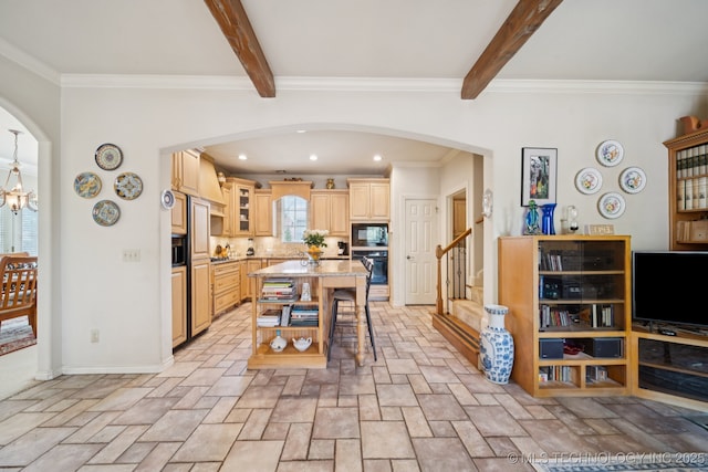 7721 E 101st Pl, Tulsa, OK 74133 - kitchen with black appliances, beam ceiling, a kitchen breakfast bar, stone tile floors, and arched walkways