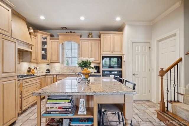 7721 E 101st Pl, Tulsa, OK 74133 - kitchen featuring black appliances, crown molding, stone tile floors, light stone counters, and tasteful backsplash
