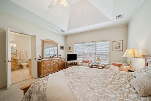 7721 E 101st Pl, Tulsa, OK 74133 - bedroom with ornamental molding, light carpet, connected bathroom, a tray ceiling, and ceiling fan