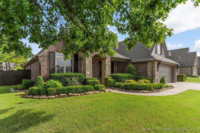 425 W 128th St S, Jenks, OK 74037 - view of front of home featuring stone siding, concrete driveway, an attached garage, and brick siding