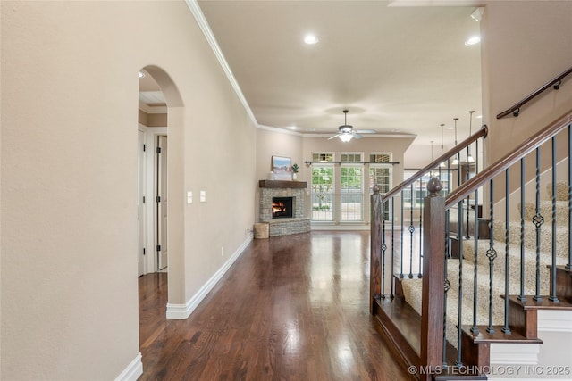425 W 128th St S, Jenks, OK 74037 - entrance foyer with ceiling fan, arched walkways, crown molding, stairs, and wood finished floors