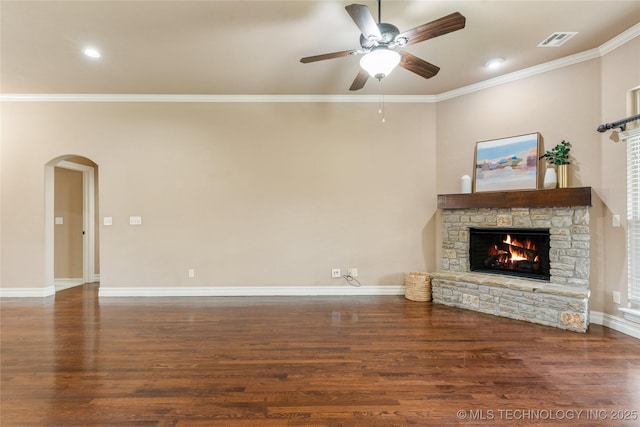 425 W 128th St S, Jenks, OK 74037 - unfurnished living room featuring ceiling fan, ornamental molding, a fireplace, wood finished floors, and arched walkways