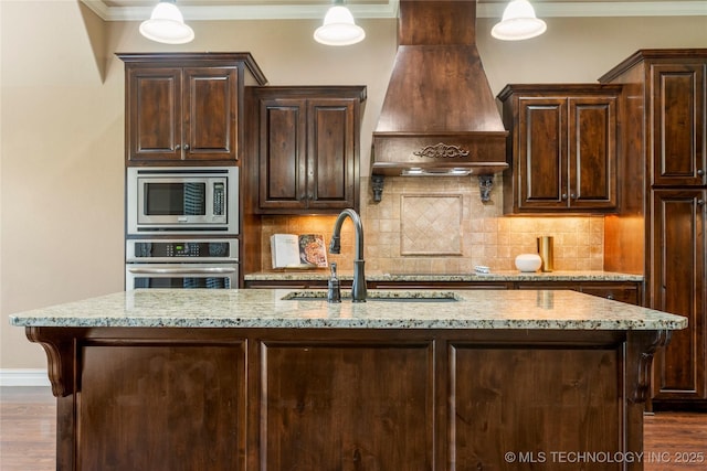 425 W 128th St S, Jenks, OK 74037 - kitchen with stainless steel appliances, premium range hood, ornamental molding, light stone countertops, and decorative backsplash