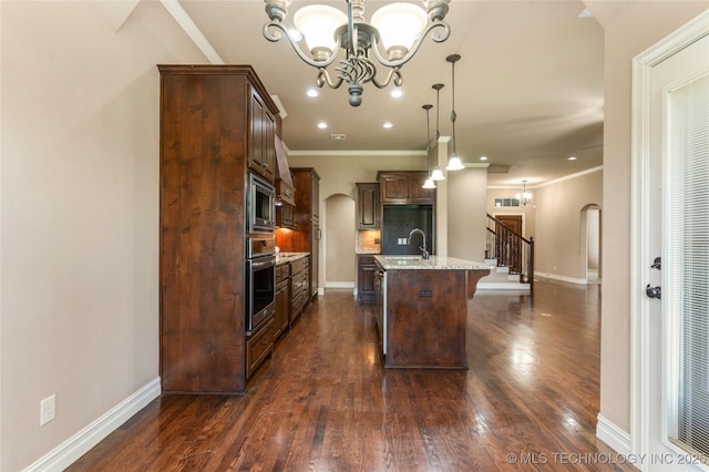 425 W 128th St S, Jenks, OK 74037 - kitchen featuring arched walkways, a chandelier, dark brown cabinets, ornamental molding, and pendant lighting
