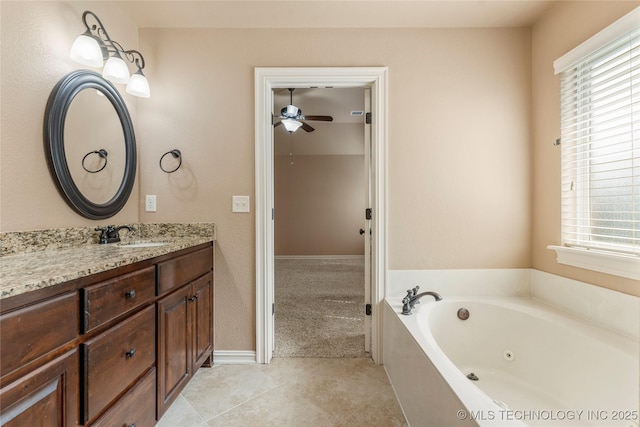 425 W 128th St S, Jenks, OK 74037 - bathroom featuring a ceiling fan, vanity, a tub with jets, and plenty of natural light