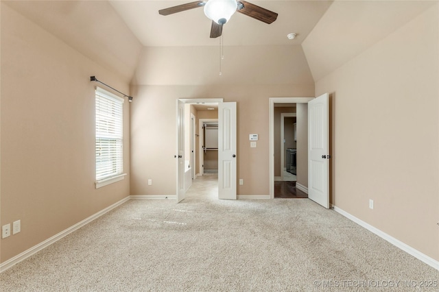 425 W 128th St S, Jenks, OK 74037 - unfurnished bedroom featuring light colored carpet, a spacious closet, lofted ceiling, and a ceiling fan