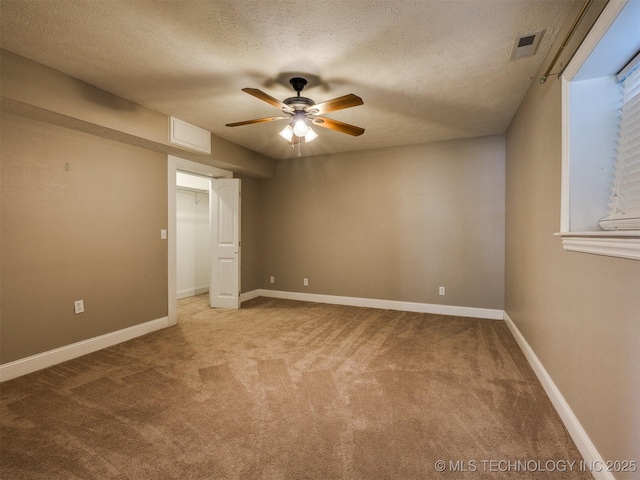 109 E Bk 800th Rd, Stigler, OK 74462 - unfurnished bedroom featuring carpet flooring, a textured ceiling, a ceiling fan, and a closet