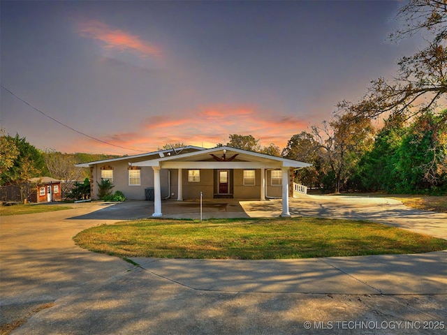 109 E Bk 800th Rd, Stigler, OK 74462 - bungalow-style house featuring driveway, an attached carport, covered porch, and a front lawn