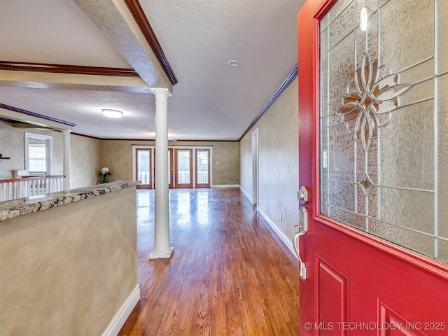 109 E Bk 800th Rd, Stigler, OK 74462 - entryway with crown molding, ornate columns, wood finished floors, and beamed ceiling