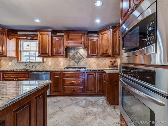 109 E Bk 800th Rd, Stigler, OK 74462 - kitchen featuring stainless steel appliances, stone countertops, backsplash, hanging light fixtures, and premium range hood