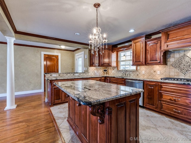 109 E Bk 800th Rd, Stigler, OK 74462 - kitchen with stainless steel appliances, ornamental molding, a kitchen island, a chandelier, and stone countertops