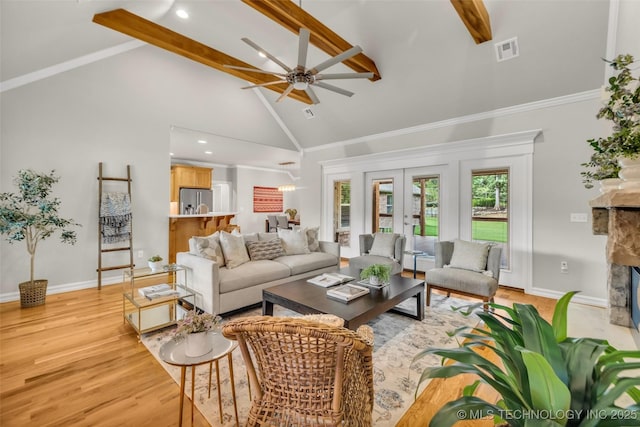 7380 Royalwood Way, Tulsa, OK 74131 - living room with high vaulted ceiling, beam ceiling, ceiling fan, a fireplace, and french doors