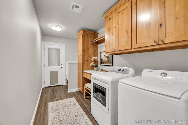 7380 Royalwood Way, Tulsa, OK 74131 - laundry area with washer and clothes dryer, dark wood-type flooring, and cabinet space