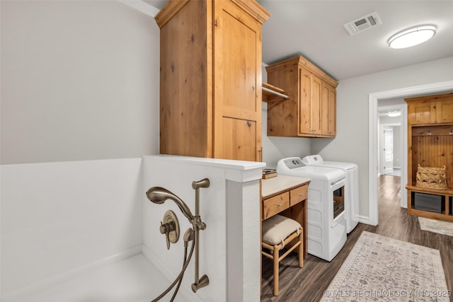 7380 Royalwood Way, Tulsa, OK 74131 - laundry room with washing machine and dryer, dark wood-type flooring, and cabinet space