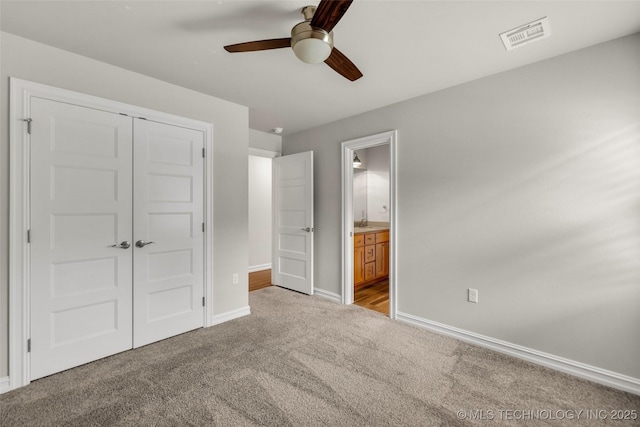 7380 Royalwood Way, Tulsa, OK 74131 - unfurnished bedroom with carpet flooring, a closet, ensuite bath, and ceiling fan