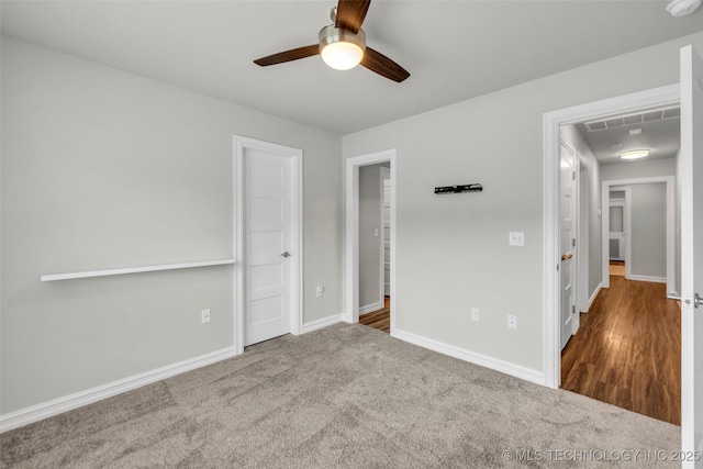 7380 Royalwood Way, Tulsa, OK 74131 - unfurnished bedroom with carpet, a ceiling fan, and attic access