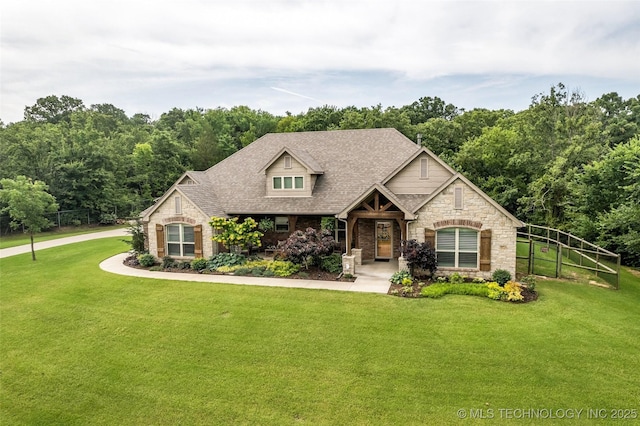7380 Royalwood Way, Tulsa, OK 74131 - view of front of home with stone siding and roof with shingles