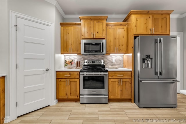 7380 Royalwood Way, Tulsa, OK 74131 - kitchen featuring stainless steel appliances, crown molding, light countertops, decorative backsplash, and brown cabinets