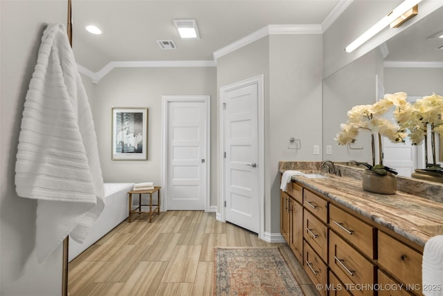 7380 Royalwood Way, Tulsa, OK 74131 - bathroom featuring crown molding, vanity, and wood finished floors