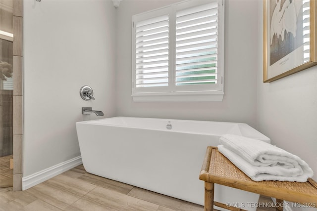 7380 Royalwood Way, Tulsa, OK 74131 - bathroom featuring a freestanding bath and a tile shower