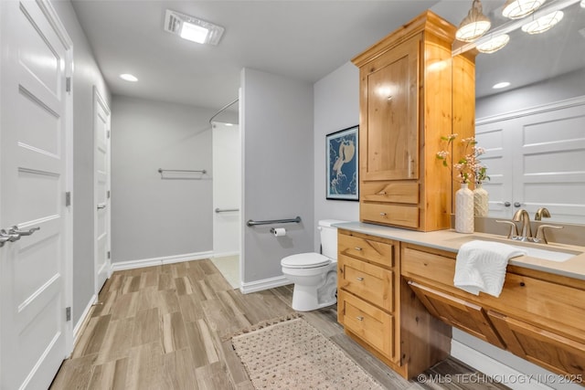 7380 Royalwood Way, Tulsa, OK 74131 - full bathroom with vanity, wood finished floors, and recessed lighting