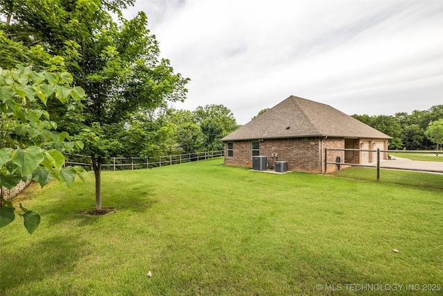 7380 Royalwood Way, Tulsa, OK 74131 - fenced backyard with driveway and view of scattered trees