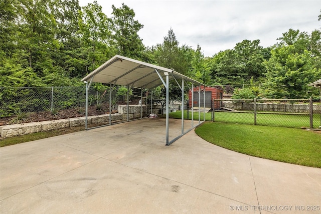 7380 Royalwood Way, Tulsa, OK 74131 - view of patio / terrace with a detached carport, concrete driveway, and an outdoor structure
