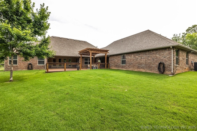 7380 Royalwood Way, Tulsa, OK 74131 - back of property featuring a pergola, a shingled roof, a lawn, brick siding, and a patio area