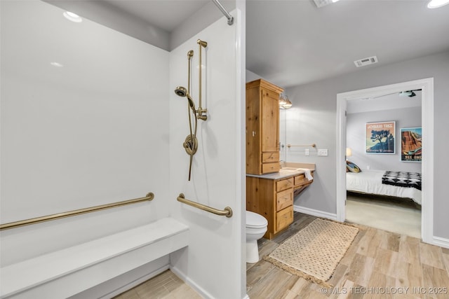 7380 Royalwood Way, Tulsa, OK 74131 - full bathroom with toilet and wood finished floors