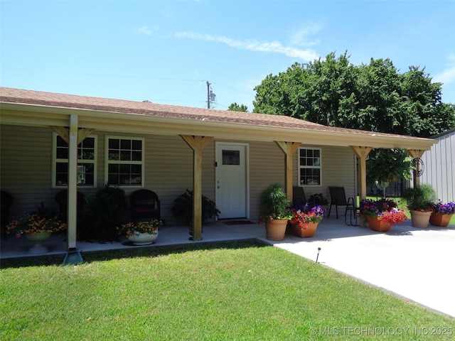 419124 E 1144th Rd, Checotah, OK 74426 - back of property featuring a yard and a patio area