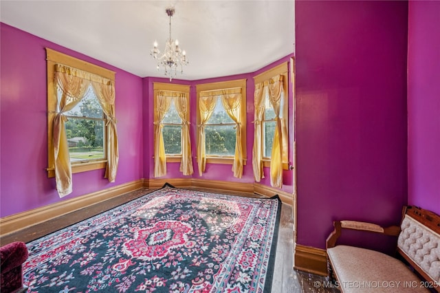 415 S 13th St, Muskogee, OK 74401 - living area featuring a chandelier and wood finished floors
