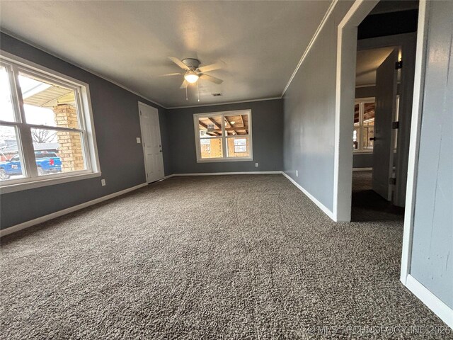 305 NW 4th St Unit 1/2, Wilburton, OK 74578 - carpeted empty room with ceiling fan and ornamental molding