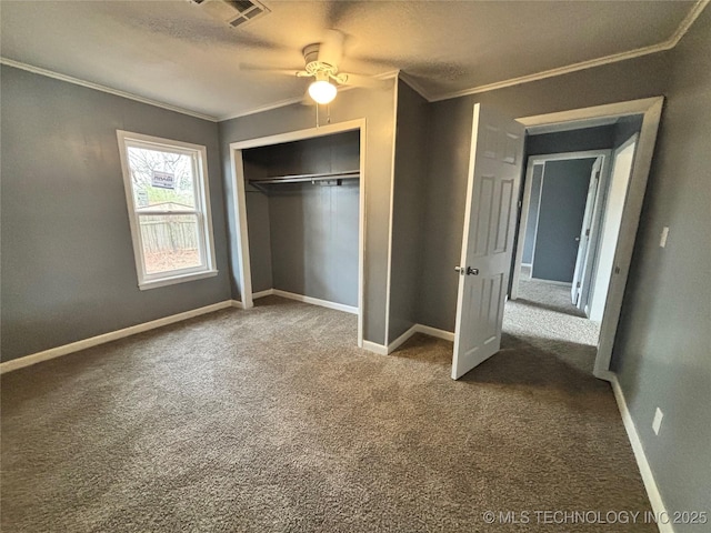 305 NW 4th St Unit 1/2, Wilburton, OK 74578 - unfurnished bedroom with crown molding, a closet, carpet floors, and a ceiling fan
