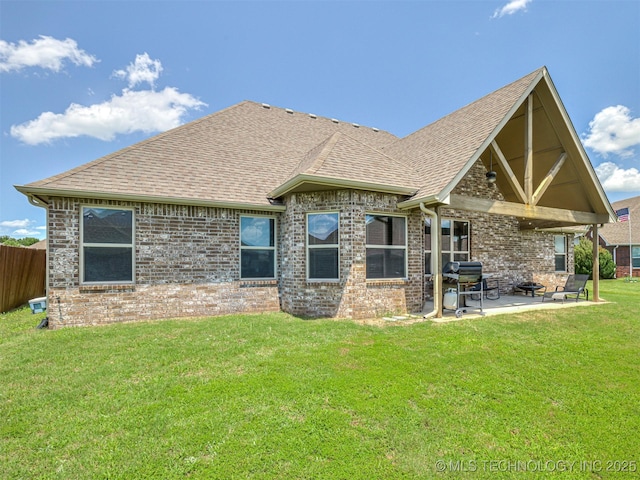 7616 E 84th St, Owasso, OK 74021 - back of house featuring a patio area, a shingled roof, and brick siding