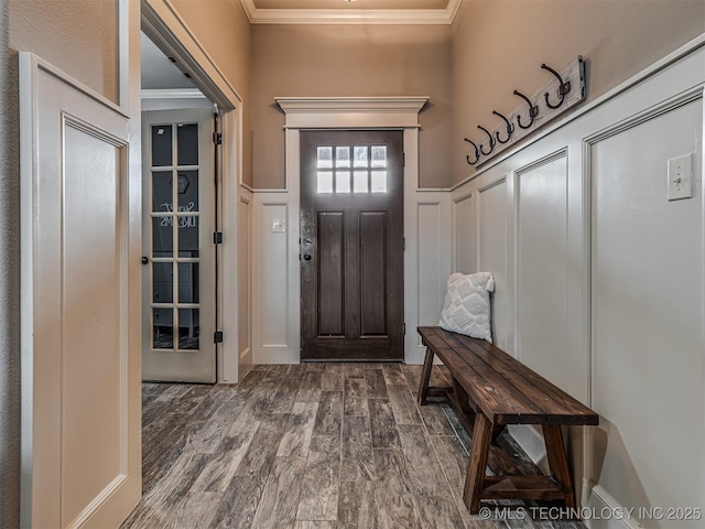 7616 E 84th St, Owasso, OK 74021 - foyer entrance featuring ornamental molding, dark wood-type flooring, a decorative wall, and a wainscoted wall