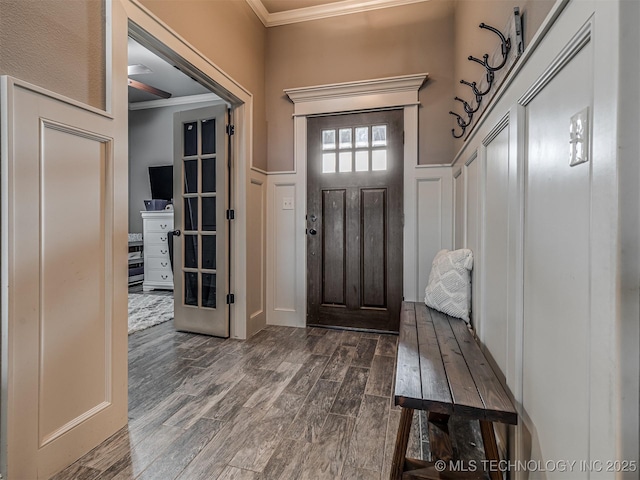 7616 E 84th St, Owasso, OK 74021 - entryway with ornamental molding, dark wood finished floors, and a decorative wall