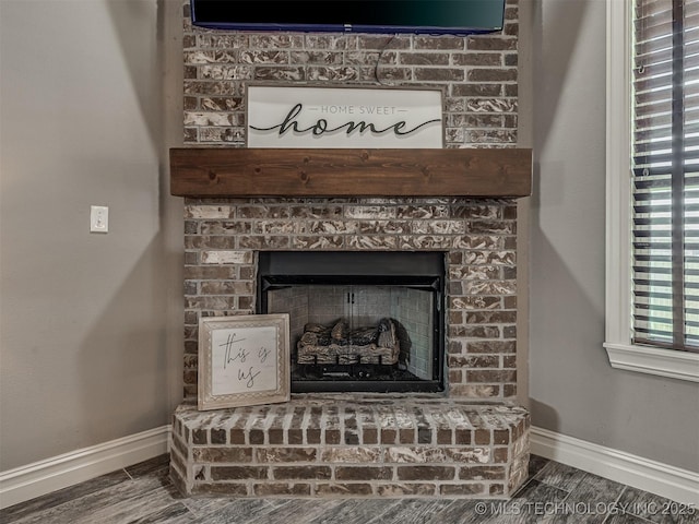 7616 E 84th St, Owasso, OK 74021 - detailed view of baseboards and a brick fireplace