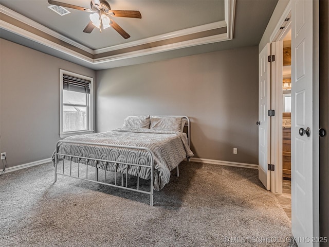 7616 E 84th St, Owasso, OK 74021 - bedroom with a tray ceiling, ornamental molding, carpet, and a ceiling fan