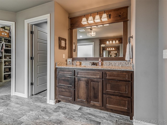 7616 E 84th St, Owasso, OK 74021 - bathroom featuring vanity and wood finished floors