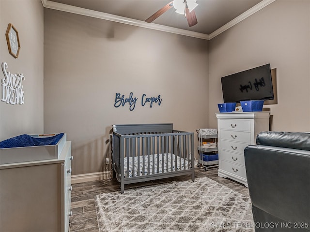 7616 E 84th St, Owasso, OK 74021 - bedroom featuring ornamental molding, wood finished floors, a crib, and ceiling fan