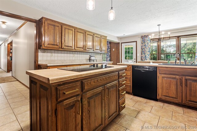 9644 Ew 19 Rd, Nowata, OK 74048 - kitchen with black appliances, light tile patterned floors, light countertops, backsplash, and a textured ceiling