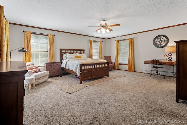 9644 Ew 19 Rd, Nowata, OK 74048 - bedroom with carpet floors, ornamental molding, a textured ceiling, and a ceiling fan