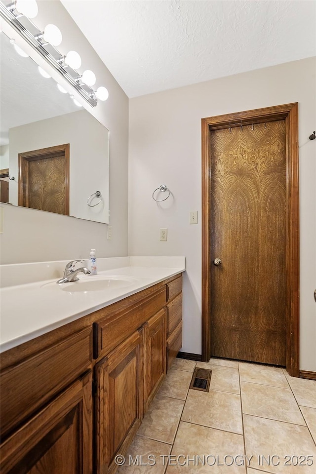 9644 Ew 19 Rd, Nowata, OK 74048 - bathroom featuring vanity and tile patterned floors