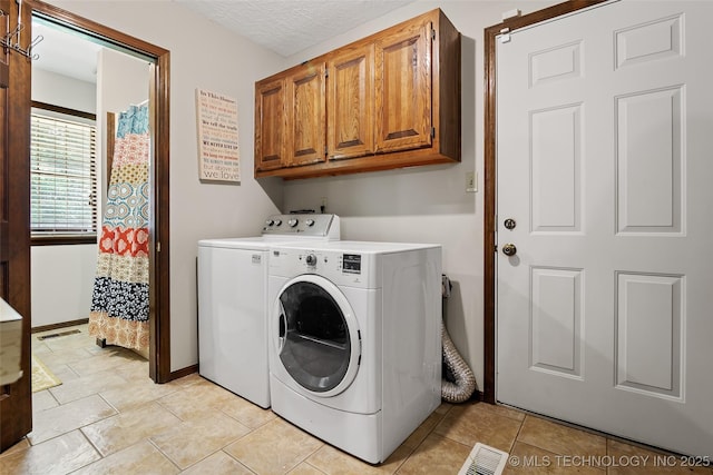 9644 Ew 19 Rd, Nowata, OK 74048 - laundry area with washer and dryer and cabinet space